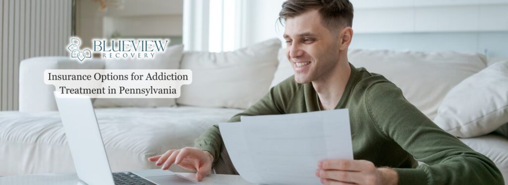 man reviewing insurance options for addiction treatment on a laptop