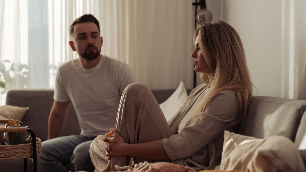 How to Help Someone Addicted to Cocaine: A Guide for Families and Friends 2 Two adults sitting together at home during a serious, emotional conversation.