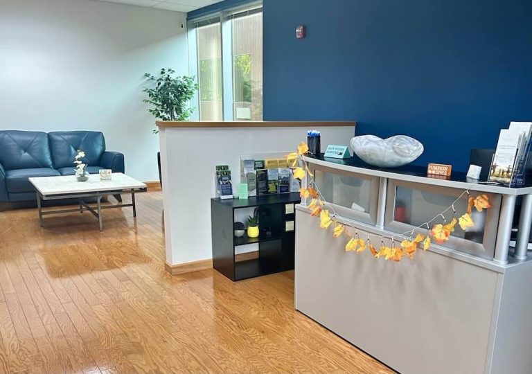 Blueview Recovery reception desk with brochures, fall decor, and waiting area seating.