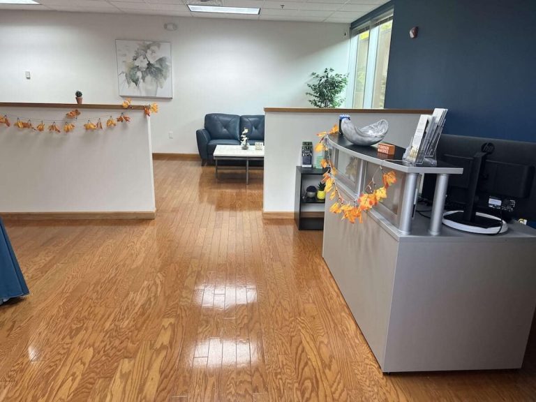 Blueview Recovery reception area with desk, fall decor, and waiting lounge.