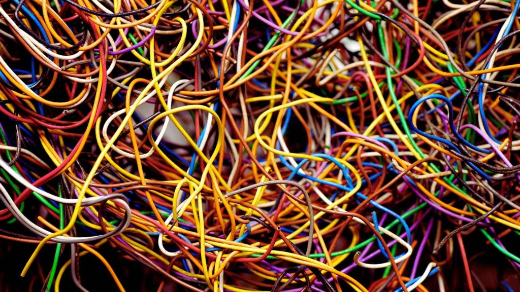 A tangled mass of colorful wires symbolizing mental chaos and confusion.