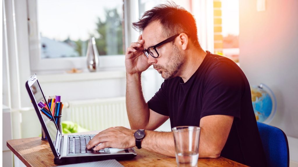 Person attending a virtual IOP session from home on a laptop