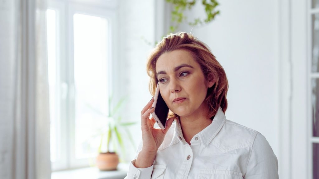 Woman calling a support person as part of her relapse prevention plan