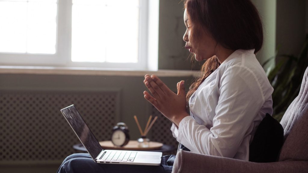 Benefits of a Virtual IOP for Addiction Recovery 1 Person participating in a virtual IOP therapy session from home