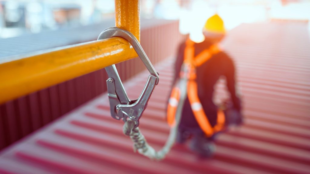 Safety harness clipped to a rail symbolizing support and protection in addiction treatment