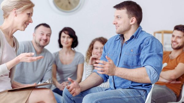 a happy group therapy session for heroin addiction