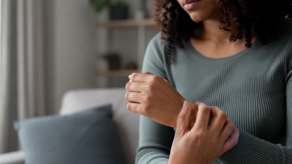 How to Stop Shaking from Anxiety Immediately hero image of a woman experiencing anxiety shaking.