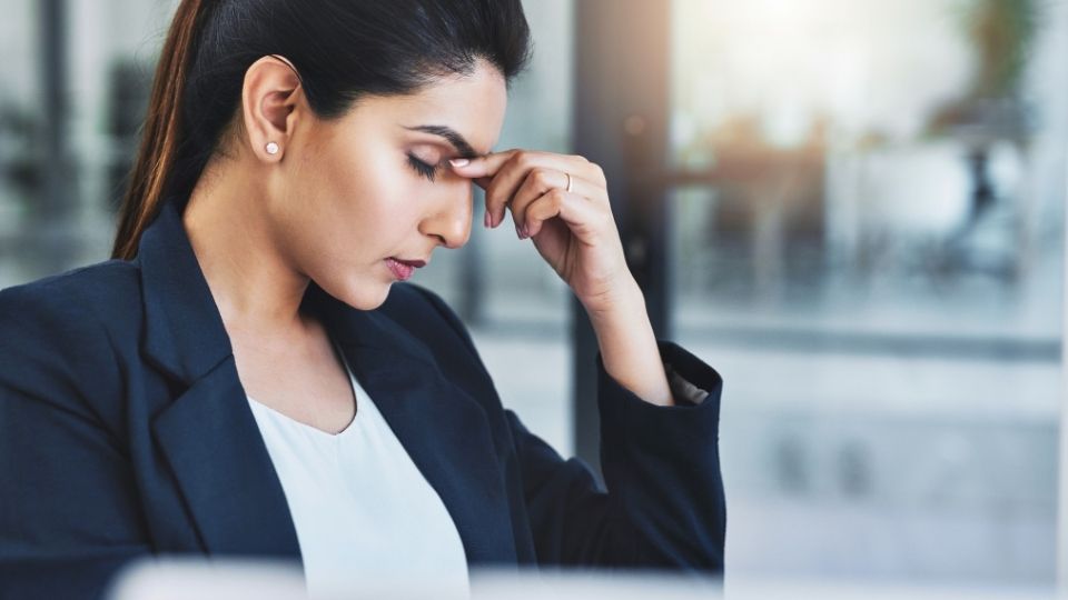 functional depression hero image of successful woman hiding the obvious signs while working.