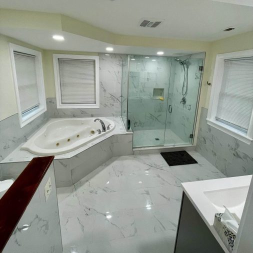 Bathroom with jacuzzi tub and glass shower